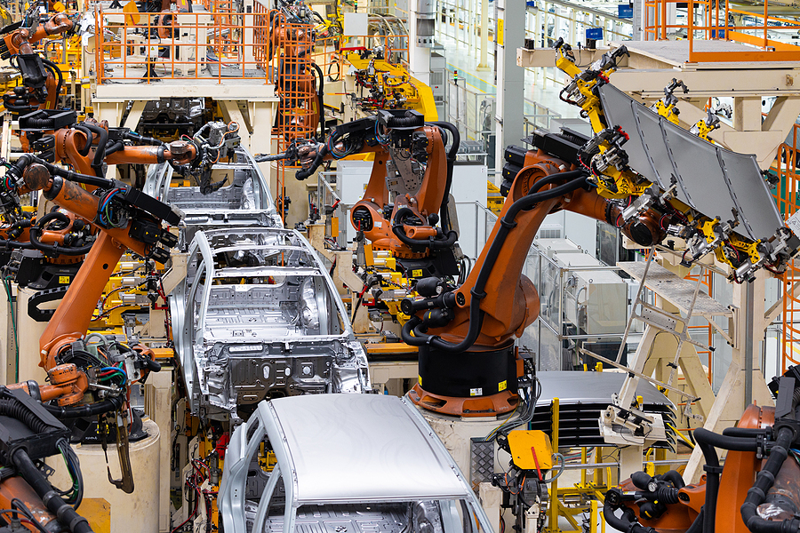 Car Bodies Are On Assembly Line. Factory For Production Of Cars.